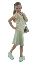 Load image into Gallery viewer, This Just Athletic Exercise Skirt for Girls Sizes, designed by Dressing For His Glory, is a must-have for the sweltering summer months. Crafted with high-performance sport fabric, it guarantees to keep you cool and dry, all while remaining incredibly durable and wrinkle-free.