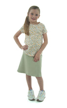 Load image into Gallery viewer, Athletic Exercise Skirt for Girls Sizes by Dressing For His Glory offers a perfect blend of modesty and comfort for girls. Its design allows for maximum movement while maintaining coverage. Ideal for sports and active lifestyles, this skirt provides both functionality and style. Bike shorts underneath are attached at the waistband.