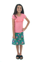 Load image into Gallery viewer, The Freestyle Swim Skirt is a high-performing swimwear option that combines style and functionality. Designed with a chlorine-resistant fabric that stretches and dries quickly, this skirt features attached bike shorts and an elastic waist for comfort and ease of movement.