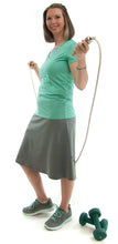 Load image into Gallery viewer, Athletic Exercise Skirt for Ladies Sizes by Dressing For His Glory is perfect for all team sports is with performance sport fabric that keeps you dry. Bike shorts are attached to the waistband of the skirt and has an optional zipper pocket. The Athletic Exercise Skirt has a smooth flat elastic waistband. Great for any sport activity!
