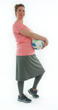 Load image into Gallery viewer, This Athletic Exercise Skirt by Dressing For His Glory is ideal for outdoor team sports, offering a durable performance sport fabric that wicks away moisture. Featuring attached long leggings with an optional zipper pocket, this skirt boasts a smooth flat elastic waistband, making it suitable for all winter sport activities.