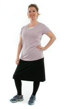 Load image into Gallery viewer, This Athletic Exercise Skirt by Dressing For His Glory is ideal for outdoor team sports, offering a durable performance sport fabric that wicks away moisture. Featuring attached long leggings with an optional zipper pocket, this skirt boasts a smooth flat elastic waistband, making it suitable for all winter sport activities.