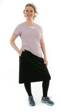 Load image into Gallery viewer, This Athletic Exercise Skirt by Dressing For His Glory is ideal for outdoor team sports, offering a durable performance sport fabric that wicks away moisture. Featuring attached long leggings with an optional zipper pocket, this skirt boasts a smooth flat elastic waistband, making it suitable for all winter sport activities.