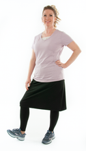 Load image into Gallery viewer, This Athletic Exercise Skirt by Dressing For His Glory is ideal for outdoor team sports, offering a durable performance sport fabric that wicks away moisture. Featuring attached long leggings with an optional zipper pocket, this skirt boasts a smooth flat elastic waistband, making it suitable for all winter sport activities.