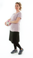 Load image into Gallery viewer, This Athletic Exercise Skirt by Dressing For His Glory is ideal for outdoor team sports, offering a durable performance sport fabric that wicks away moisture. Featuring attached long leggings with an optional zipper pocket, this skirt boasts a smooth flat elastic waistband, making it suitable for all winter sport activities.