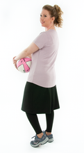 Load image into Gallery viewer, This Athletic Exercise Skirt by Dressing For His Glory is ideal for outdoor team sports, offering a durable performance sport fabric that wicks away moisture. Featuring attached long leggings with an optional zipper pocket, this skirt boasts a smooth flat elastic waistband, making it suitable for all winter sport activities.