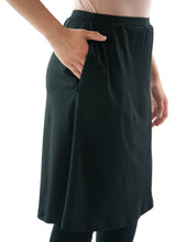Load image into Gallery viewer, This Athletic Exercise Skirt by Dressing For His Glory is ideal for outdoor team sports, offering a durable performance sport fabric that wicks away moisture. Featuring attached long leggings with an optional zipper pocket, this skirt boasts a smooth flat elastic waistband, making it suitable for all winter sport activities.