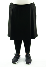 Load image into Gallery viewer, Athletic Exercise Skirt for Womens Plus Sizes by Dressing For His Glory is perfect for all outdoor team sports. It is made with performance sport fabric that keeps you dry. The long leggings are attached to the waistband of the skirt and has an optional zipper pocket. Perfect for winter sport activities.