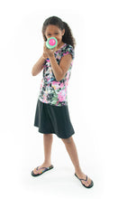 Load image into Gallery viewer, The Freestyle Swim Skirt is a high-performing swimwear option that combines style and functionality. Designed with a chlorine-resistant fabric that stretches and dries quickly, this skirt features attached bike shorts and an elastic waist for comfort and ease of movement.