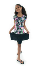 Load image into Gallery viewer, The Freestyle Swim Skirt is a high-performing swimwear option that combines style and functionality. Designed with a chlorine-resistant fabric that stretches and dries quickly, this skirt features attached bike shorts and an elastic waist for comfort and ease of movement.