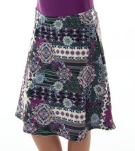 Load image into Gallery viewer, Freestyle Swim Skirt for Girls Sizes by Dressing For His Glory  Our Freestyle Swim Skirt is a great skirt to swim in. It is made in a chlorine resistant swimwear fabric that stretches with you and dries quickly! The skirt has bike short underneath and are attached at the elastic waist. The Freestyle Swim Skirt is great looking and keeps you cool and comfortable.