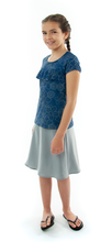 Load image into Gallery viewer, Freestyle Swim Skirt for Girls Sizes by Dressing For His Glory  Our Freestyle Swim Skirt is a great skirt to swim in. It is made in a chlorine resistant swimwear fabric that stretches with you and dries quickly! The skirt has bike short underneath and are attached at the elastic waist. The Freestyle Swim Skirt is great looking and keeps you cool and comfortable.