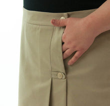 Load image into Gallery viewer, The School Uniform Skirt for Women's Plus Sizes by Dressing For His Glory has two off centered pleats in the front and back. It has a single button front closure with a small pocket. The skirt has a contour waistband and is comfortable, extremely durable, stain resistant, and great looking the entire school year!