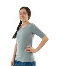 Load image into Gallery viewer, Swim Tee for Junior Sizes by Dressing For His Glory Our Swim tees  are made in top quality, fast drying swimwear knit fabric. The fabric is chlorine resistant, cool and comfortable. Our swim tees are fully lined to help prevent clinging. It has a scooped neck and a choice of a cap sleeve or a longer length sleeve.