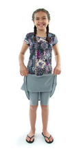 Load image into Gallery viewer, Freestyle Swim Skirt for Girls Sizes by Dressing For His Glory  Our Freestyle Swim Skirt is a great skirt to swim in. It is made in a chlorine resistant swimwear fabric that stretches with you and dries quickly! The skirt has bike short underneath and are attached at the elastic waist. The Freestyle Swim Skirt is great looking and keeps you cool and comfortable.