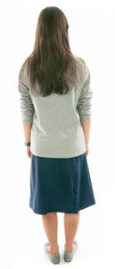 Flare Skort for Junior Sizes by Dressing For His Glory The Flare Skort is a flare skirt with loose fitting shorts underneath that are attached at the waistband.  It has a flat front waist with an elastic waistband in the back and slit pockets on each side panel. The skirt has one optional off centered slit in the front and one in the back.    The skirt and shorts are made in the same fabric with the shorts being 1" shorter than the skirt.