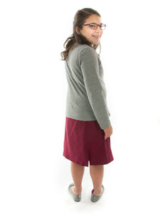 Flare Skort for Girls Plus Sizes by Dressing For His Glory The Flare Skort is a flare skirt with loose fitting shorts underneath that are attached at the waistband.  It has a flat front waist with an elastic waistband in the back. The skirt has one optional off centered slit in the front and one in the back.  The skirt and shorts are made in the same fabric with the shorts being 1" shorter than the skirt.