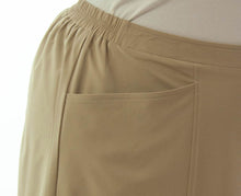 Load image into Gallery viewer, Flare Skort for Womens Plus Sizes by Dressing For His Glory The Flare Skort is a flare skirt with loose fitting shorts underneath that are attached at the waistband.  It has a flat front waist with an elastic waistband in the back and slit pockets on each side panel. The skirt has one optional off centered slit in the front and one in the back. 