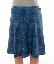 Load image into Gallery viewer, Freestyle Swim Skirt for Junior Sizes by Dressing For His Glory  Our Freestyle Swim Skirt is a great skirt to swim in. It is made in a chlorine resistant swimwear fabric that stretches with you and dries quickly! The skirt has bike short underneath and are attached at the elastic waist. The Freestyle Swim Skirt is great looking and keeps you cool and comfortable.