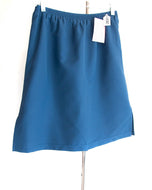 #2631 Sale Rack Item /  Swim Straight Skort / Junior Medium / Navy by Dressing For His Glory is a straight skirt that  looks like a skirt both front and back- loose fitting knit shorts underneath that  are attached at waist - comfortable and modest-fast drying fabric- hidden vents at the waist to prevent ballooning- elastic waist extremely durable wears well even in high chlorinated pools