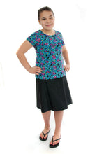 Load image into Gallery viewer, Freestyle Swim Skirt for Girls Plus Sizes by Dressing For His Glory  Our Freestyle Swim Skirt is a great skirt to swim in. It is made in a chlorine resistant swimwear fabric that stretches with you and dries quickly! The skirt has bike short underneath and are attached at the elastic waist. The Freestyle Swim Skirt is great looking and keeps you cool and comfortable.