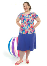 Load image into Gallery viewer, Swim Flare Skort for Womens Plus Sizes by Dressing For His Glory  Are you looking for durability when shopping for modest swimwear?  Well, our Swim Flare Skort is not only durable but modest and comfortable! This skort is slightly flared giving you extra leg room to swim and looks like a skirt both front and back. It has loose fitting knit shorts underneath and are attached at the waist. The skirt has two zipper pockets on the side panels to store your keys.