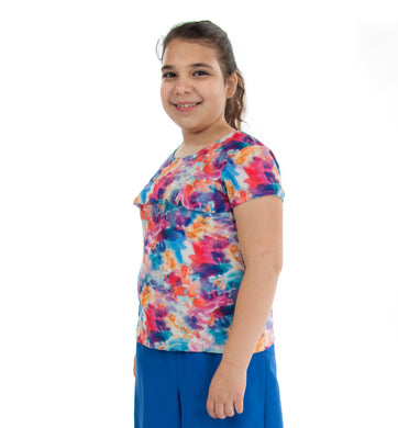 Swim Tee for Girls Plus Size by Dressing For His Glory  Our Swim Tees are made in top quality, fast drying swimwear knit fabric. The fabric is chlorine resistant, cool and comfortable. The swim tee is fully lined and helps to prevent clinging. It has a scooped neck and a choice of a cap sleeves or a longer length sleeve. It also has a beautiful ruffle across the yoke.