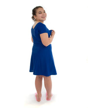 Load image into Gallery viewer, Swim Dress for Girls Plus Sizes by Dressing For His Glory  Your daughter will absolutely love the Swim Dress in our Girls Plus Sizes. It is made in chlorine resistant, fast drying swimwear fabric that is rated UPF 50+. Your daughter can just step into it from the neck and will feel free to swim or do those cartwheels on the beach! 